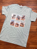 Sea foam green t-shirt with graphic designs on a wooden floor